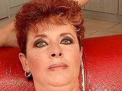 Ugly older chick is being aided in cumming with a dildo